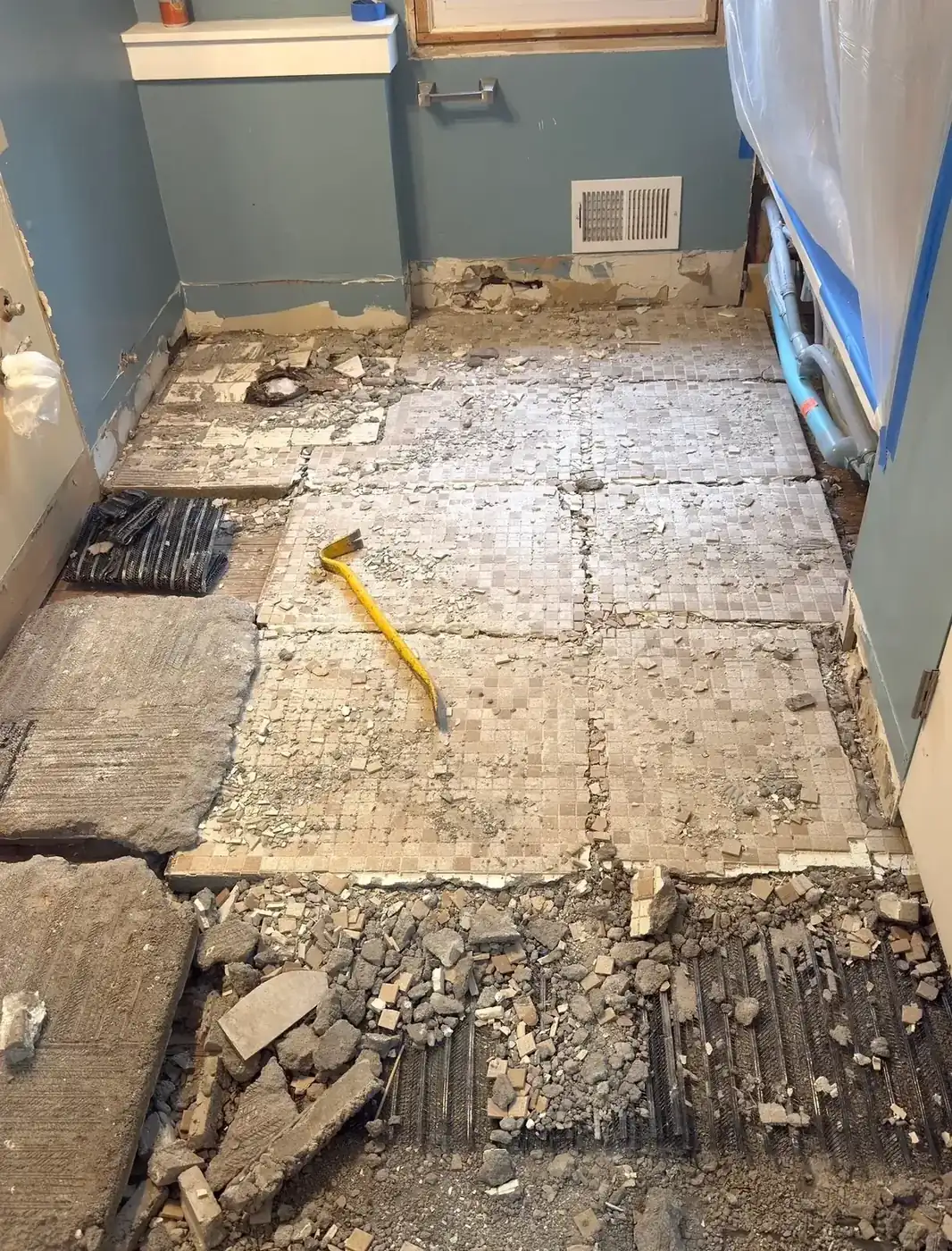 Mud-set bathroom floor removal by Demohaulic in Bloomfield Hills, Michigan