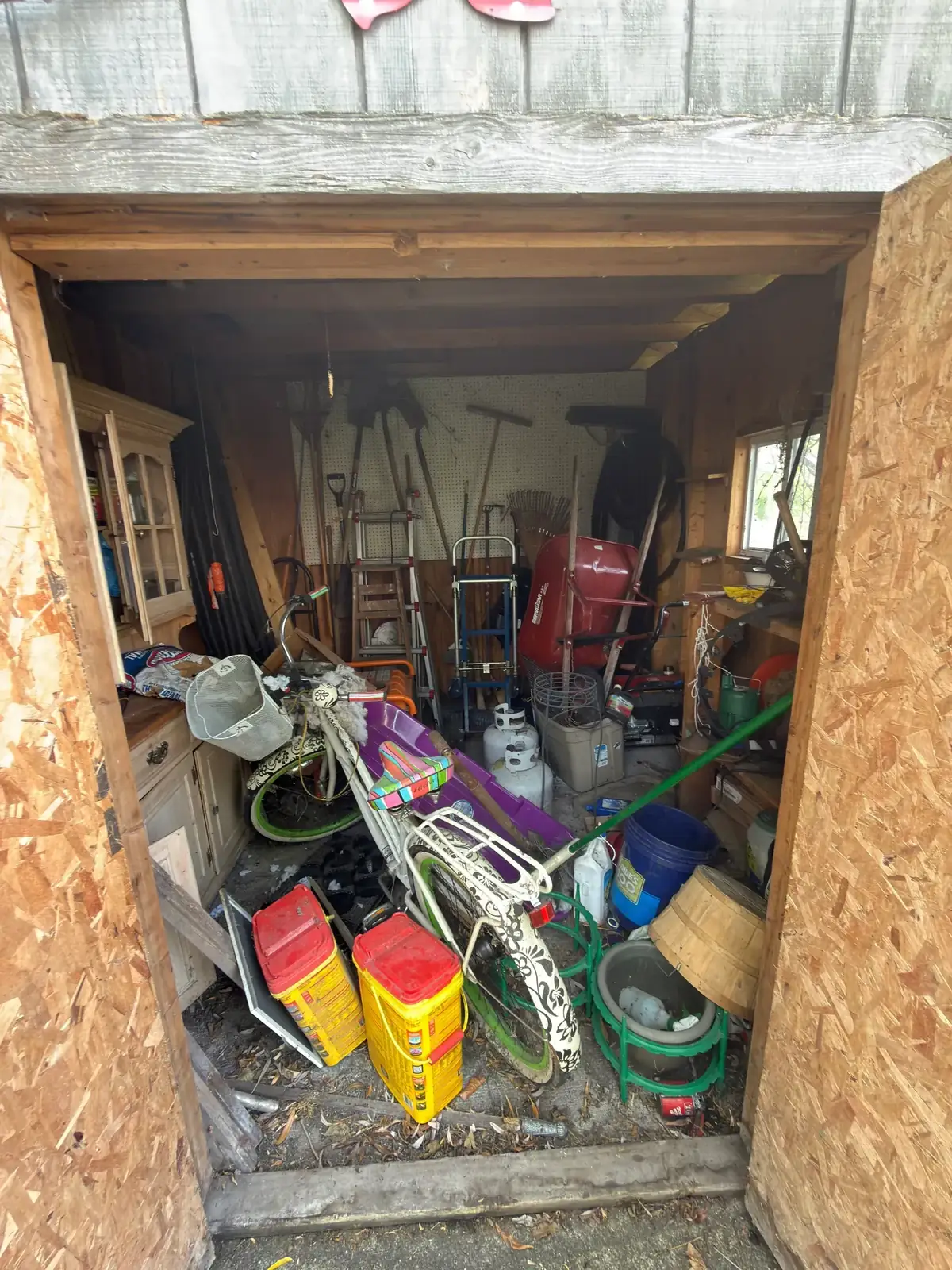 Junk-filled shed ready for a Demohaulic load-out in Metro Detroit, Michigan