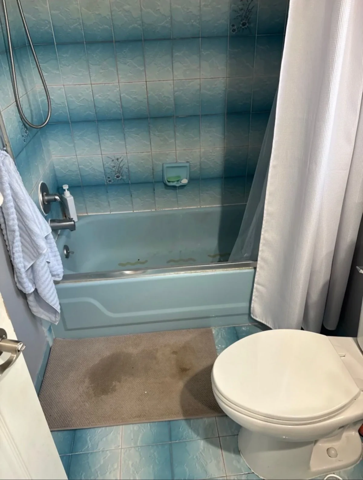 Blue upstairs bathroom before demolition in Farmington Hills Michigan