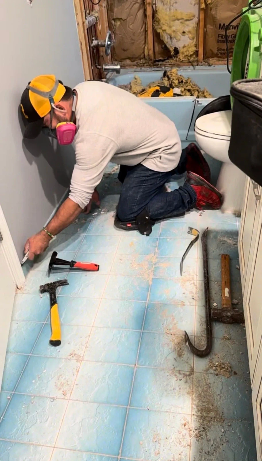 Bathroom floor demolition in progress during upstairs remodel prep