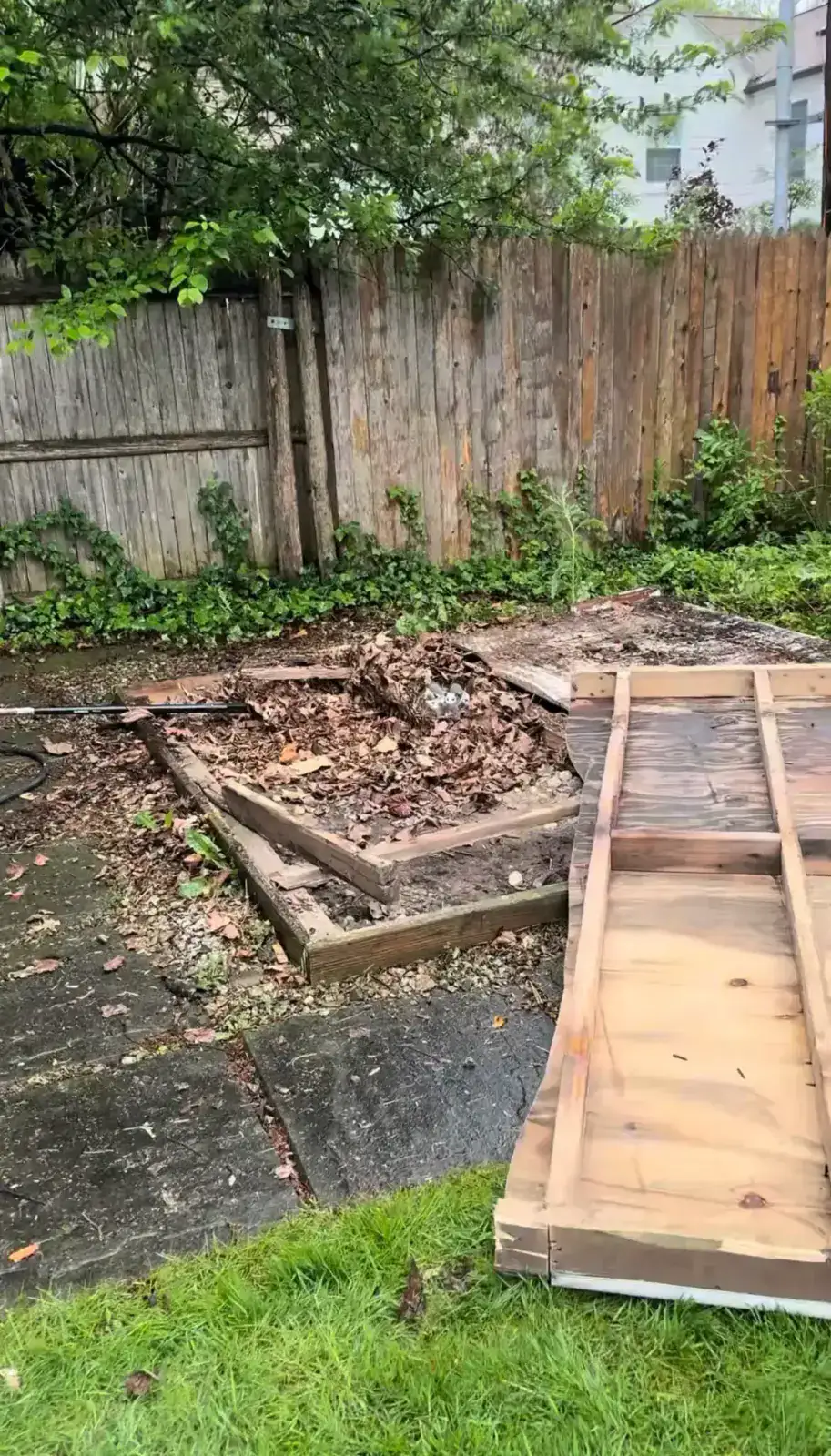 Wooden shed foundation being removed during shed demolition in Grosse Pointe Farms Michigan