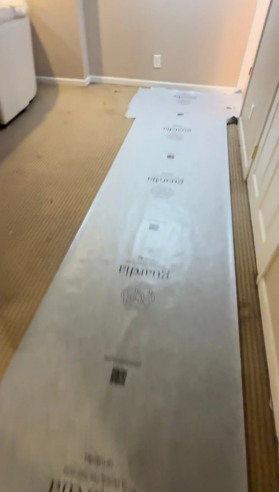 Vanity and bathroom fixtures being removed during basement demolition