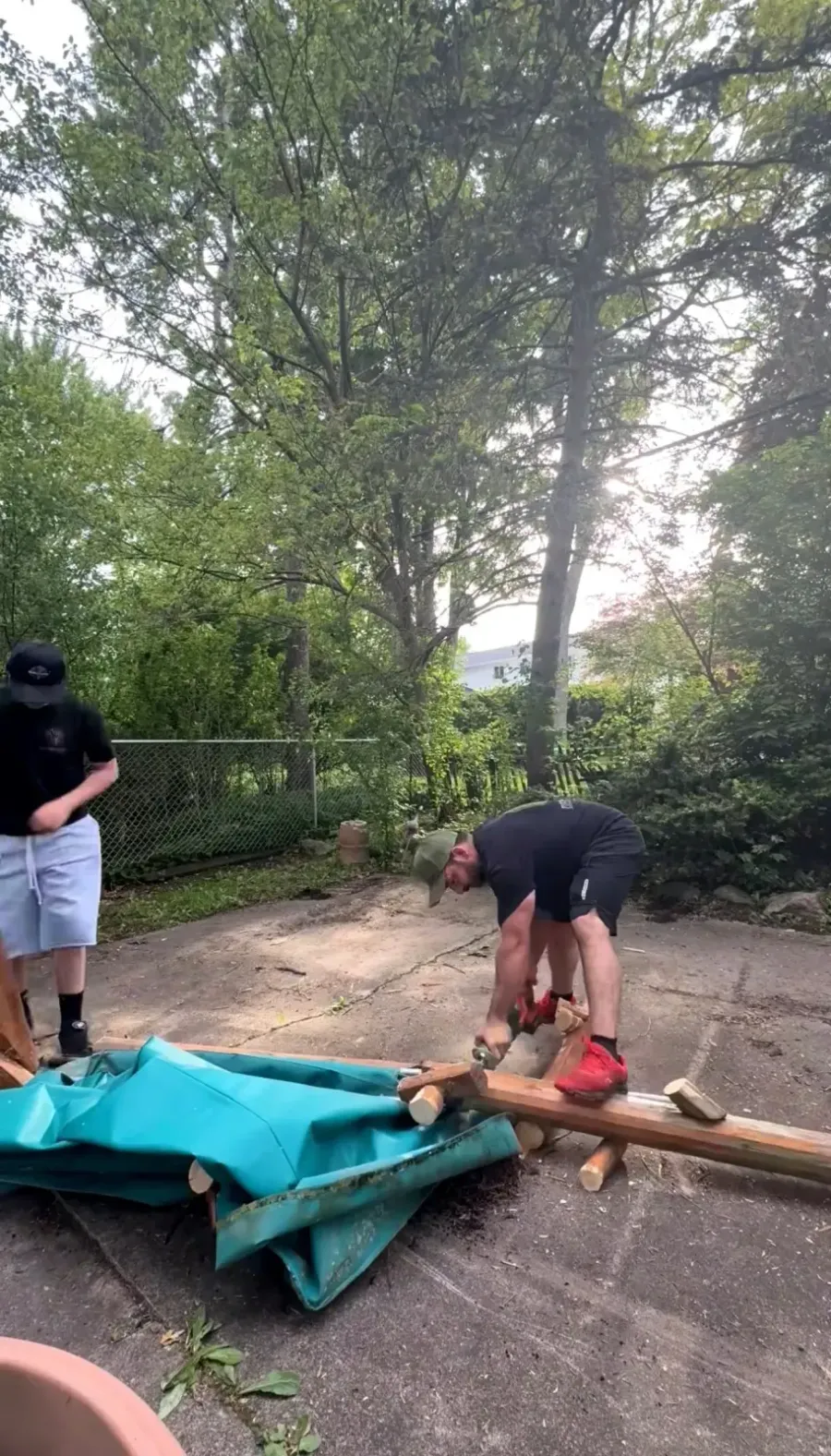 Covered wooden swing structure being dismantled in Grosse Pointe Woods MI