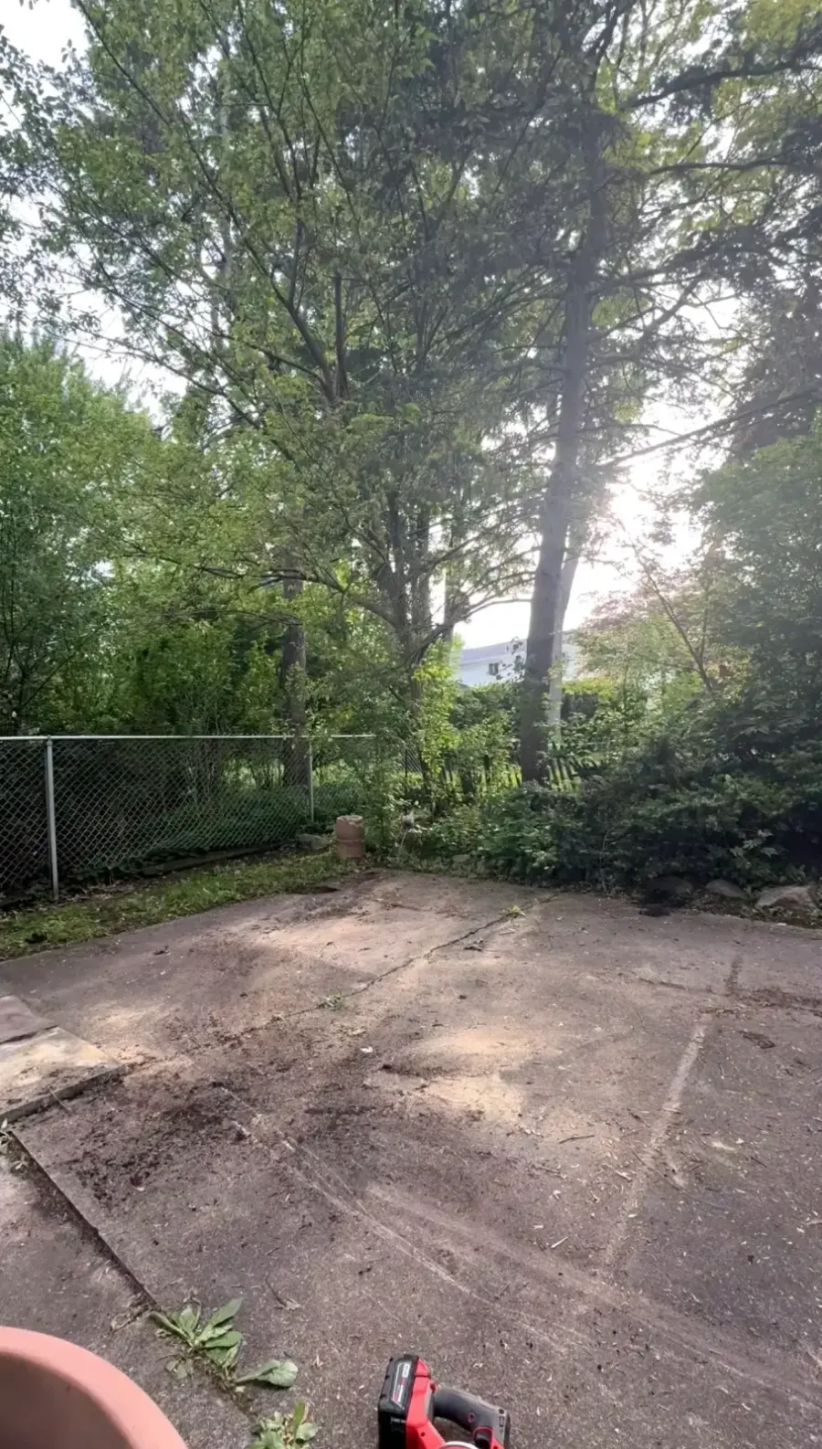 Concrete patio cleared after swing structure removal in Grosse Pointe Woods Michigan