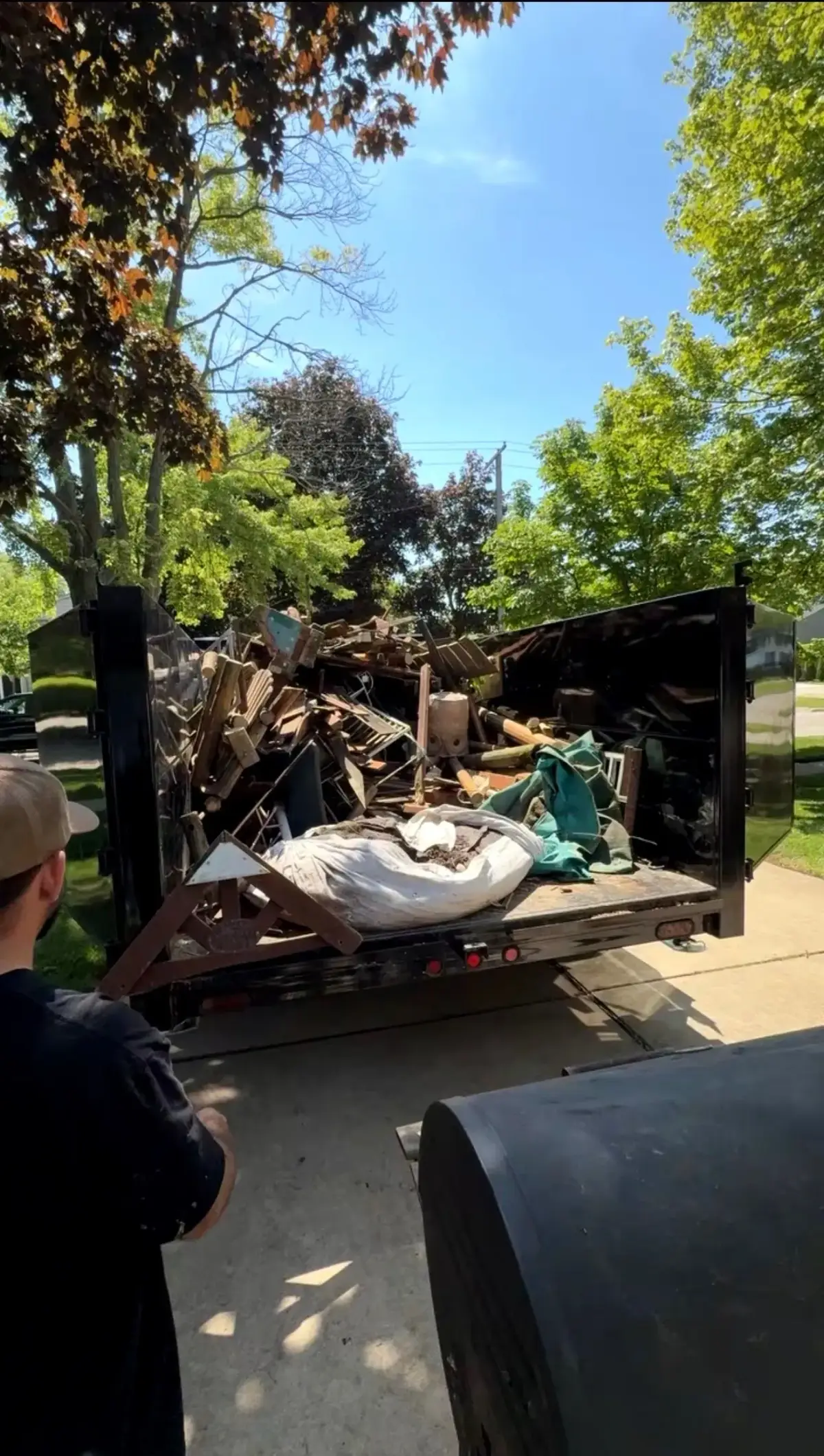 Demolition debris from playset, playhouse and swing structure loaded for disposal in Grosse Pointe Woods Michigan